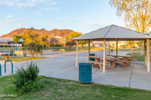 surrounding community featuring a mountain view and a gazebo