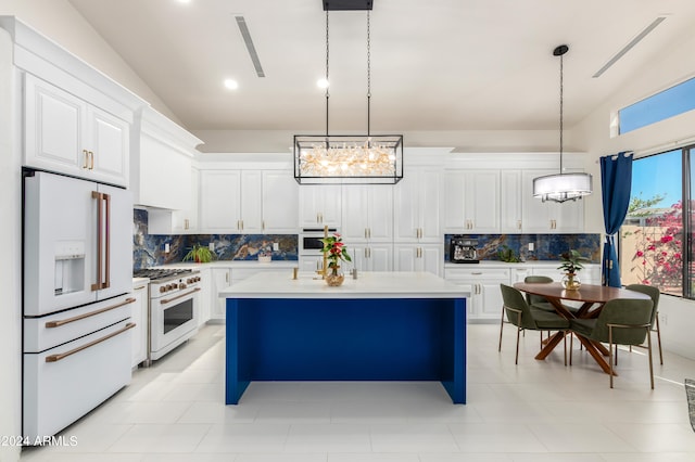 kitchen featuring backsplash, pendant lighting, and high end appliances