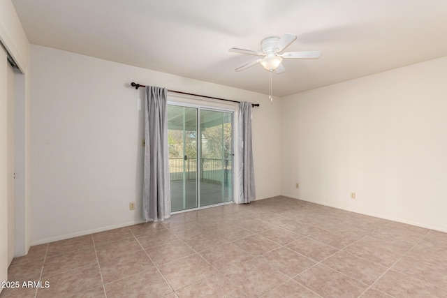 empty room with light tile patterned flooring and ceiling fan