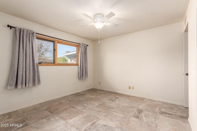 empty room featuring ceiling fan