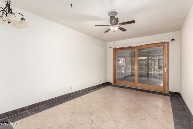 tiled spare room with ceiling fan