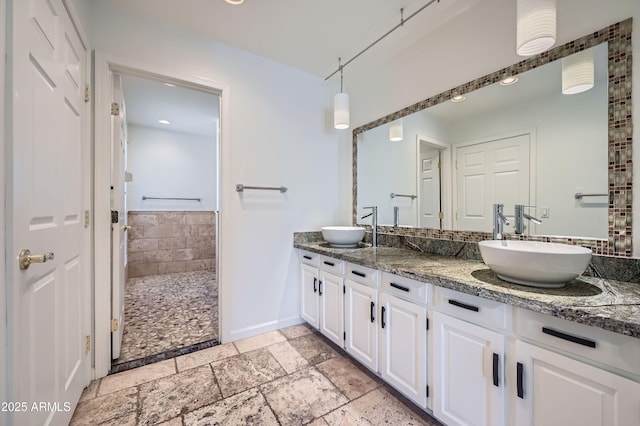 bathroom with vanity and walk in shower