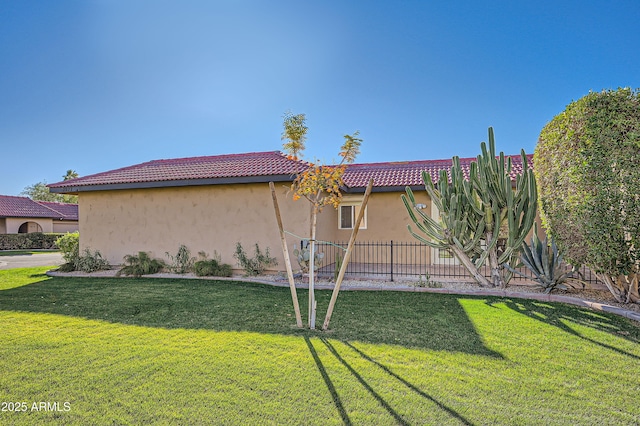 view of home's exterior with a yard