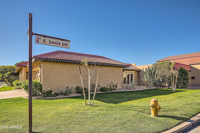 view of home's exterior featuring a yard