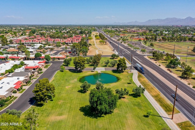 drone / aerial view featuring a residential view and a mountain view