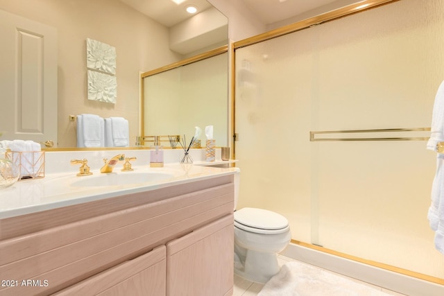 bathroom featuring toilet, tile patterned flooring, a shower stall, and vanity