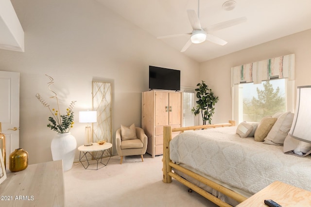 carpeted bedroom with lofted ceiling