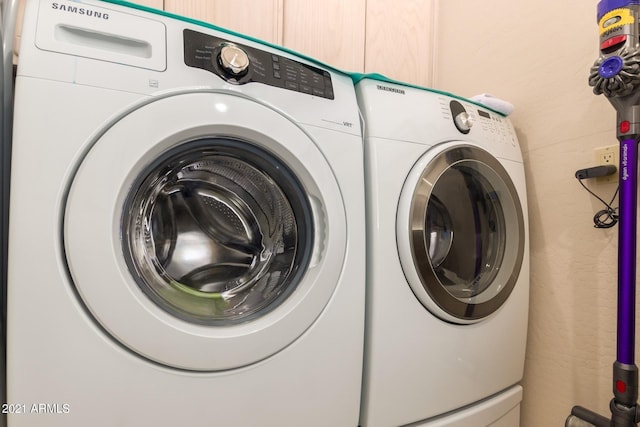 laundry area featuring laundry area and washing machine and clothes dryer