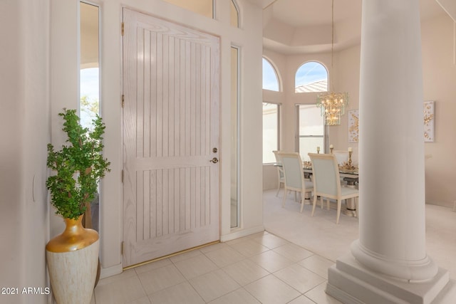 entryway featuring a notable chandelier and tile patterned floors