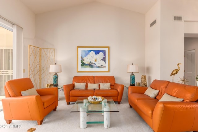 carpeted living area with vaulted ceiling and visible vents