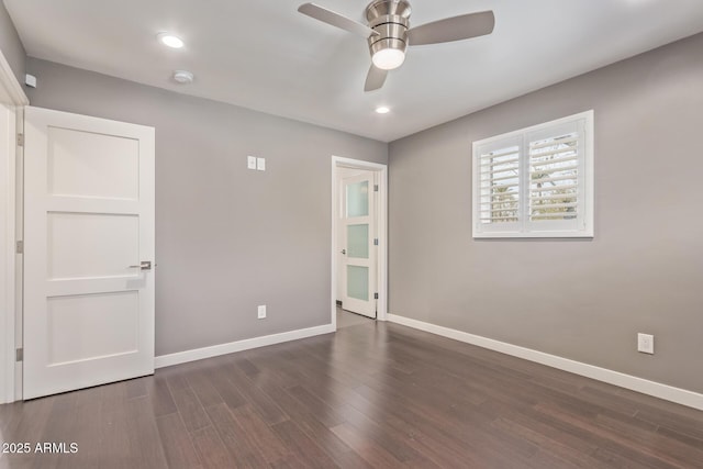 empty room featuring a ceiling fan, baseboards, wood finished floors, and recessed lighting