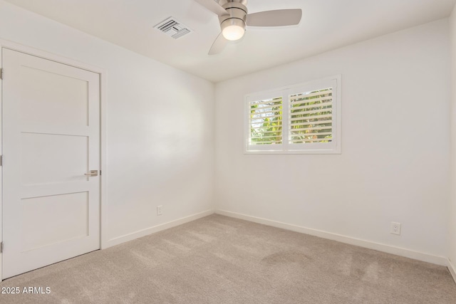 unfurnished room featuring visible vents, ceiling fan, light carpet, and baseboards