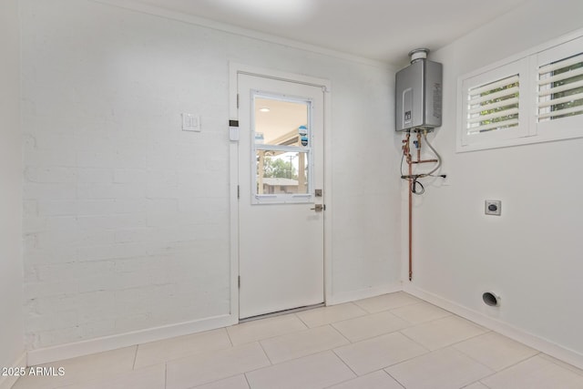 clothes washing area with a healthy amount of sunlight, laundry area, hookup for an electric dryer, and water heater