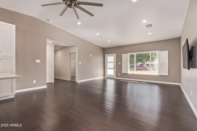 unfurnished living room with baseboards, visible vents, dark wood-style floors, vaulted ceiling, and recessed lighting