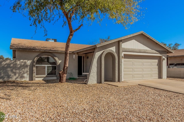 ranch-style home with a garage