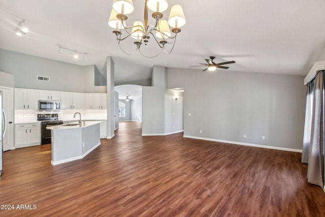 kitchen with electric range oven, ceiling fan with notable chandelier, pendant lighting, white cabinets, and dark hardwood / wood-style floors