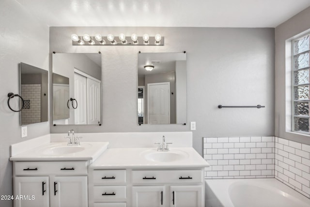 bathroom with a bathtub and vanity