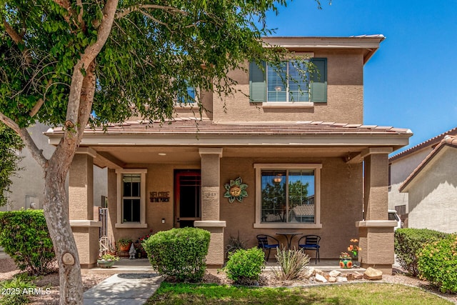 2048 S Martingale Rd, Gilbert, AZ 85295 - view of front facade featuring a porch and stucco siding