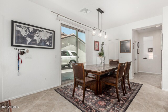 2048 S Martingale Rd, Gilbert, AZ 85295 - dining area with baseboards and light tile patterned floors