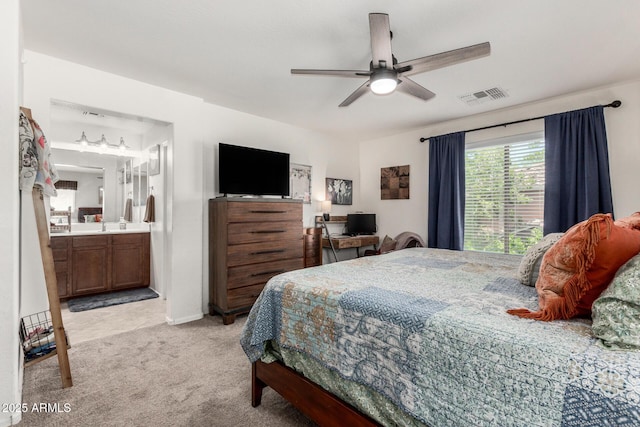 2048 S Martingale Rd, Gilbert, AZ 85295 - bedroom with light colored carpet, ensuite bathroom, and ceiling fan