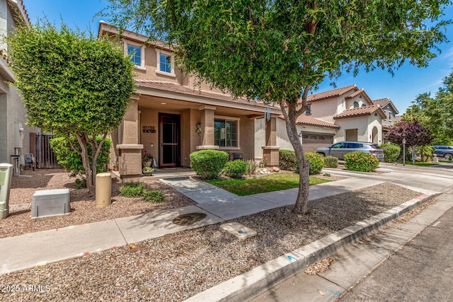 2048 S Martingale Rd, Gilbert, AZ 85295 - view of front facade featuring stucco siding, a tile roof, an attached garage, and driveway