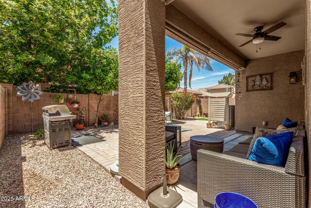 2048 S Martingale Rd, Gilbert, AZ 85295 - fenced backyard with a ceiling fan, area for grilling, a patio area, and a shed