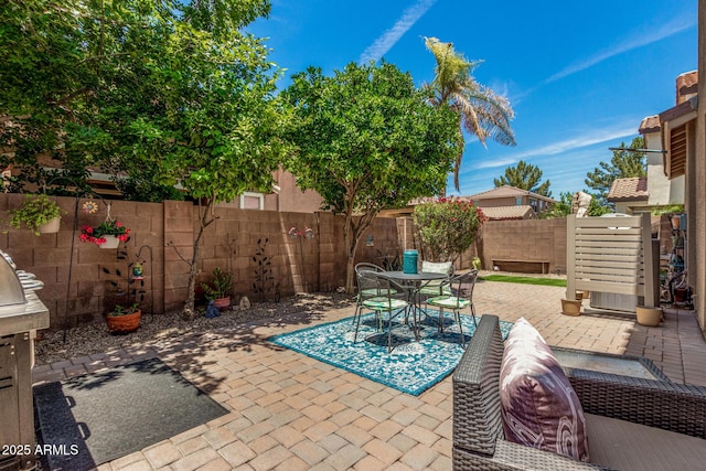 2048 S Martingale Rd, Gilbert, AZ 85295 - fenced backyard featuring a patio area and outdoor dining area