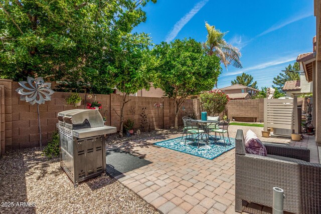 2048 S Martingale Rd, Gilbert, AZ 85295 - fenced backyard with a patio area, grilling area, and outdoor dining area