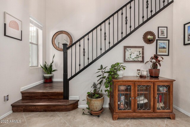 2048 S Martingale Rd, Gilbert, AZ 85295 - stairway featuring baseboards, tile patterned flooring, and a high ceiling