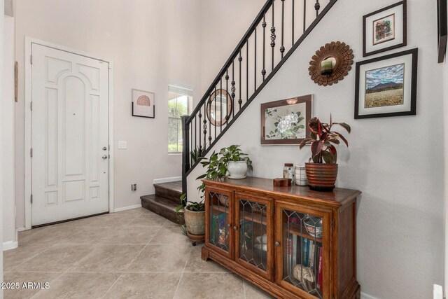 2048 S Martingale Rd, Gilbert, AZ 85295 - foyer entrance with stairway, a high ceiling, and baseboards