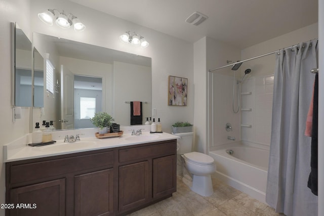 full bath featuring toilet, shower / bath combination with curtain, a sink, and visible vents