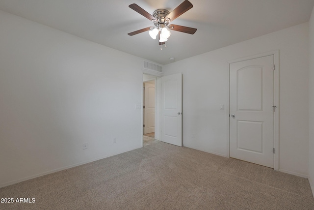 unfurnished bedroom with light carpet, ceiling fan, and visible vents