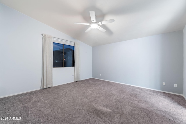 empty room with carpet flooring, ceiling fan, and vaulted ceiling