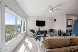 living room featuring a ceiling fan