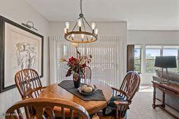 dining area featuring an inviting chandelier