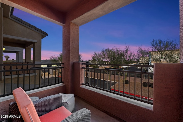 view of balcony at dusk