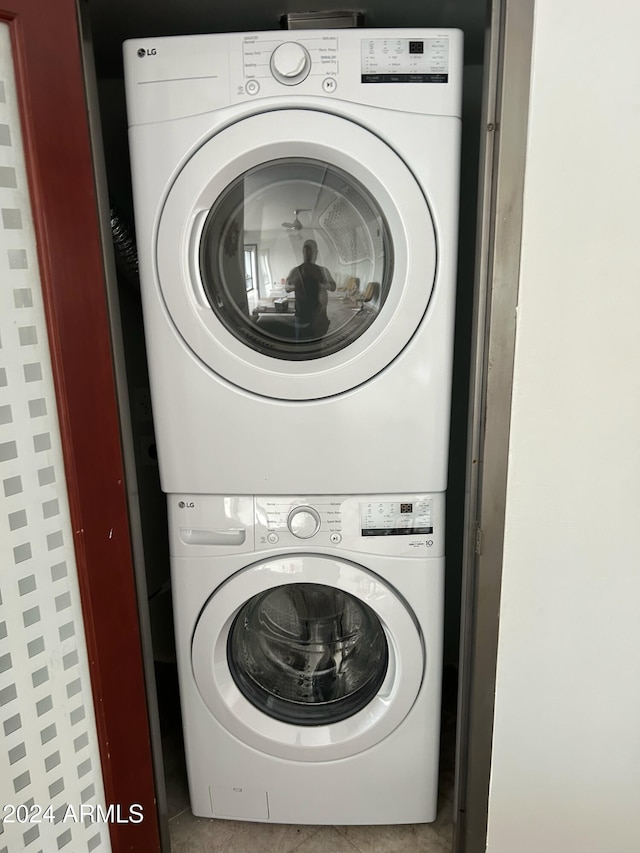 laundry area with laundry area and stacked washer and dryer