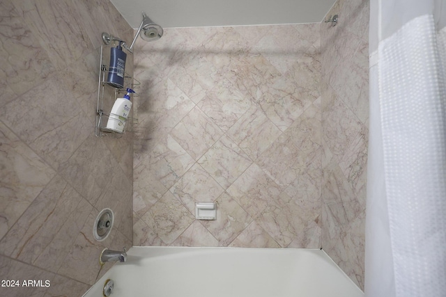 bathroom with shower / bath combo
