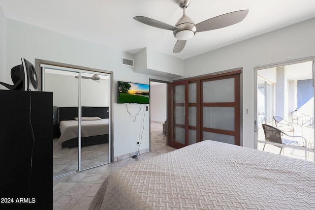 bedroom featuring visible vents, a ceiling fan, and light tile patterned floors