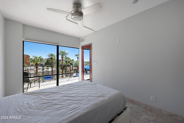 bedroom with access to exterior, ceiling fan, and light tile patterned flooring