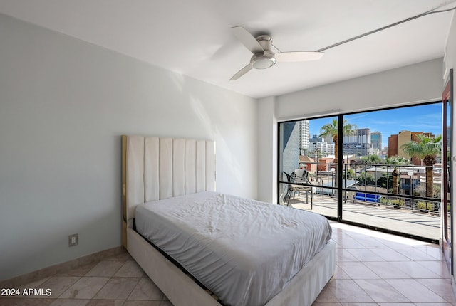 tiled bedroom featuring ceiling fan and access to outside