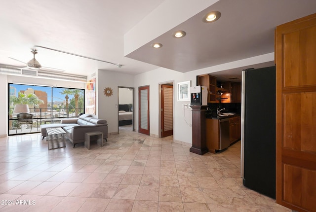 hallway with a sink and recessed lighting
