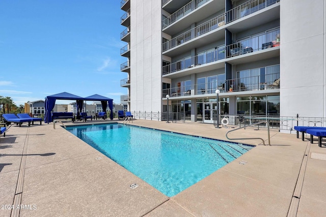 view of swimming pool with a patio