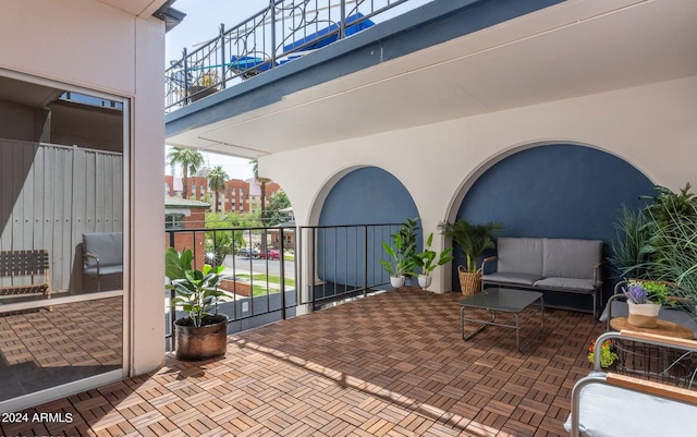 view of patio featuring a balcony