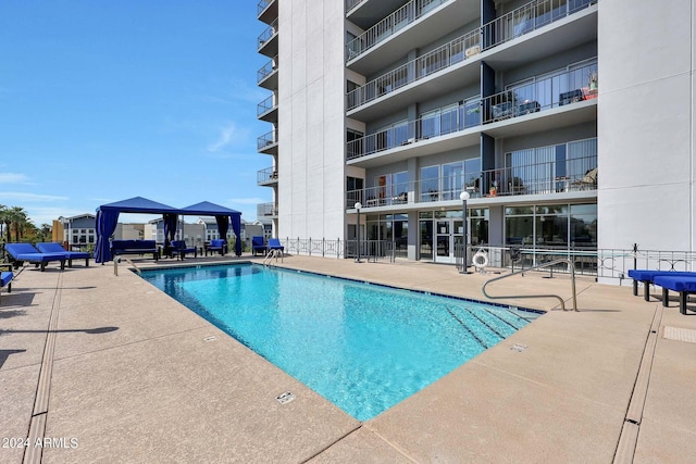 community pool featuring a patio area and a gazebo