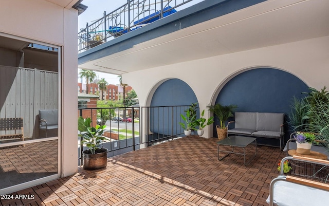 view of patio / terrace featuring an outdoor living space and a balcony