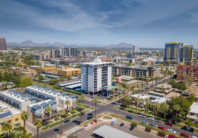 aerial view with a mountain view and a city view
