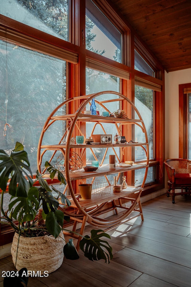 interior space with hardwood / wood-style floors, vaulted ceiling, a wealth of natural light, and wooden ceiling