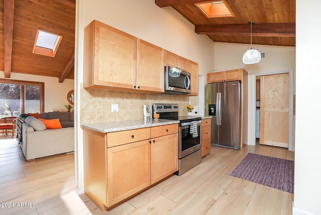 kitchen featuring appliances with stainless steel finishes, wood ceiling, and vaulted ceiling with skylight