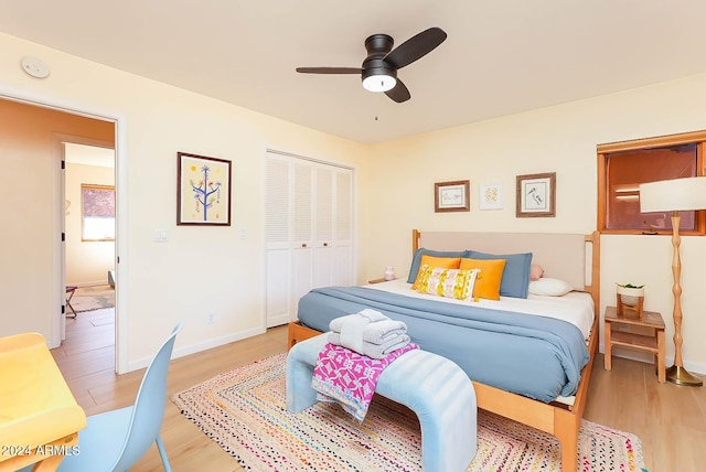 bedroom featuring a closet, ceiling fan, and light hardwood / wood-style floors